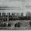 Photographic copy of a postcard.
View of Prince Arthur entering the Welcome Club.
Titled: 'Opening of the Scottish National Exhibition, Edinburgh, 1908.', 'Prince Arthur entering Welcome Club'.