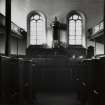 Interior showing pulpit and former windows.