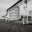 Edinburgh, Granton Gasworks, W area of site
View of surviving standard gauge railway track on W part of site, Gasholder No.2 and the flow and return legs to the three gasholders from SW