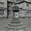 View of stone lamp base in centre of courtyard