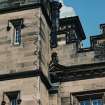 Detail of chimney, shield and carved pediment on south front