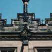 Detail of chimney, shield and carved pediment on south front