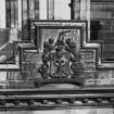 Detail of armorial panel on west face of south east tower