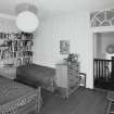 Interior. Fourth floor. Front bedroom showing panelling and fanlight