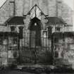 View from NW of gate to churchyard and front door of church