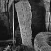 Incised outline cross slab with scale