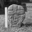 Early medieval cross slab with scale