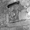 Detail showing heraldic panel in S wall.