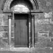 Copy of historic photograph showing detail of doorway.