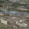 Oblique aerial view centred on the steelworks, taken from the SW.