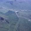 Oblique aerial view centred on the mine and buildings, taken from the NW.