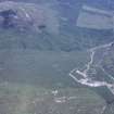 Oblique aerial view centred on the mine and buildings with farmstead adjacent, taken from the NW.