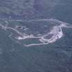 Oblique aerial view centred on the mine and buildings with farmstead adjacent, taken from the WSW.