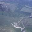 Oblique aerial view centred on the mine and buildings with farmstead adjacent, taken from the SW.