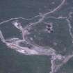 Oblique aerial view centred on the mine and buildings, taken from the SW.