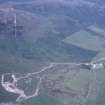 Oblique aerial view centred on the mine and buildings with farmstead adjacent, taken from the SW.