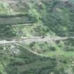 Oblique aerial view from E, across Muir Beck and the N of the TNT site.