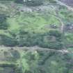 Oblique aerial view from E, across Muir Beck and the N of the TNT site.