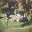 Oblique aerial view of Kildrummy Castle centred on the remains of the castle, taken from the E.