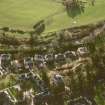 Oblique aerial view centred on Inveresk Gate, church and burial-ground, taken from the NNE.