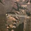 Oblique aerial view centred on the quarry, taken from the S.