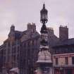 View N of Bristo Street with ornamental lamp outside the McEwan Hall and the original Woolpack Inn behind.