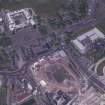 Oblique aerial view centred on the Scottish Parliament under construction with 'Our Dynamc Earth' and Holyrood Palace adjacent, taken from the W.