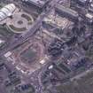 Oblique aerial view centred on the Scottish Parliament under construction with 'Our Dynamc Earth' adjacent, taken from the NNE.