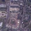 Oblique aerial view centred on the Scottish Parliament under construction with 'Our Dynamc Earth' adjacent, taken from the NE.