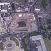 Oblique aerial view centred on the Scottish Parliament under construction, taken from the SSE.