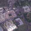 Oblique aerial view centred on the Scottish Parliament under construction with 'Our Dynamic Earth' and Holyrood Palace adjacent, taken from the S.