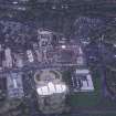 Oblique aerial view centred on the Scottish Parliament under construction with 'Our Dynamic Earth' and Holyrood Palace adjacent, taken from the SSE.