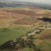 Tarbrax, oblique aerial view, taken from the S, centred on the village, with shale bings in the background.