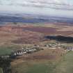 Tarbrax, oblique aerial view, taken from the SE, centred on the village, with shale bings in the background.