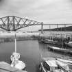 South Queensferry, harbour.
General view of harbour and Forth rail bridge from South-West showing contrasts in masonry.