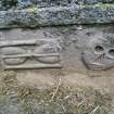 Detail of gravestone with skull and hourglass, Kettins Churchyard.