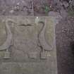 Detail of tablestone 1776 to John Graham and Guella Binning, with birds and tools, Auchterarder Parish Church burial ground.