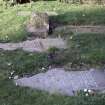 View of funerary monuments part buried within grass area, Blairgowrie Old Parish Churchyard