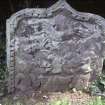 View of part buried gravestone fragment with winged soul and shield (indistinct), Blairgowrie Old Parish Churchyard