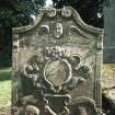 View of headstone to John Mustard d 1818 with winged soul, death symbols and Green Man, Forgandenny Parish Church burial ground.