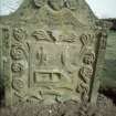 View of headstone to Amelia Paterson and 2 children 1761 with depiction of sock, coulter and boat, Kinfauns Parish Burial Ground.