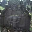 View of headstone to Elizabeth Taylor d. 1780, east face with winged soul and boy holding bell and hammer, Scone Old Parish Church.