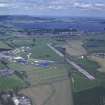 Oblique aerial view centred on T in the Park at Balado Bridge airfield, taken from the WNW.