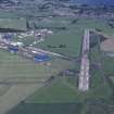 Oblique aerial view centred on T in the Park at Balado Bridge airfield, taken from the W.