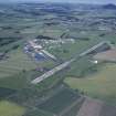 Oblique aerial view centred on T in the Park at Balado Bridge airfield, taken from the SW.