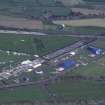 Oblique aerial view centred on T in the Park at Balado Bridge airfield, taken from the NW.