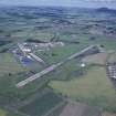 Oblique aerial view centred on T in the Park at Balado Bridge airfield, taken from the SW.