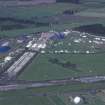 Oblique aerial view centred on T in the Park at Balado Bridge airfield, taken from the S.