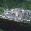 Oblique aerial view centred on Stanley Mills, taken from the S.