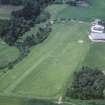 Oblique aerial view centred on the airfield and museum, taken from the ENE.